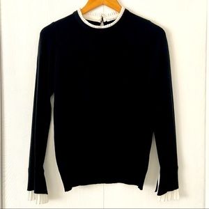 Black light sweater with ruffle details